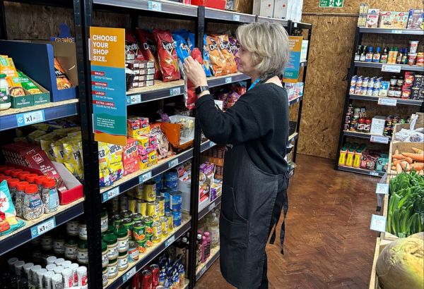 Team member stacking shelves in Darlington