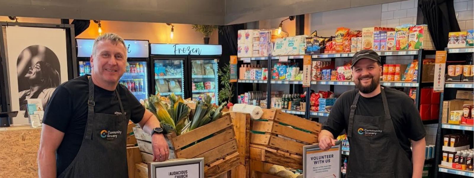 Two members of the Grocery team pose for a photo in the shop.